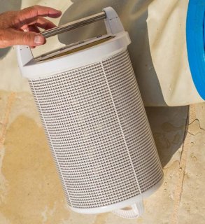 The Woodlands pool tech cleans a pool filter.